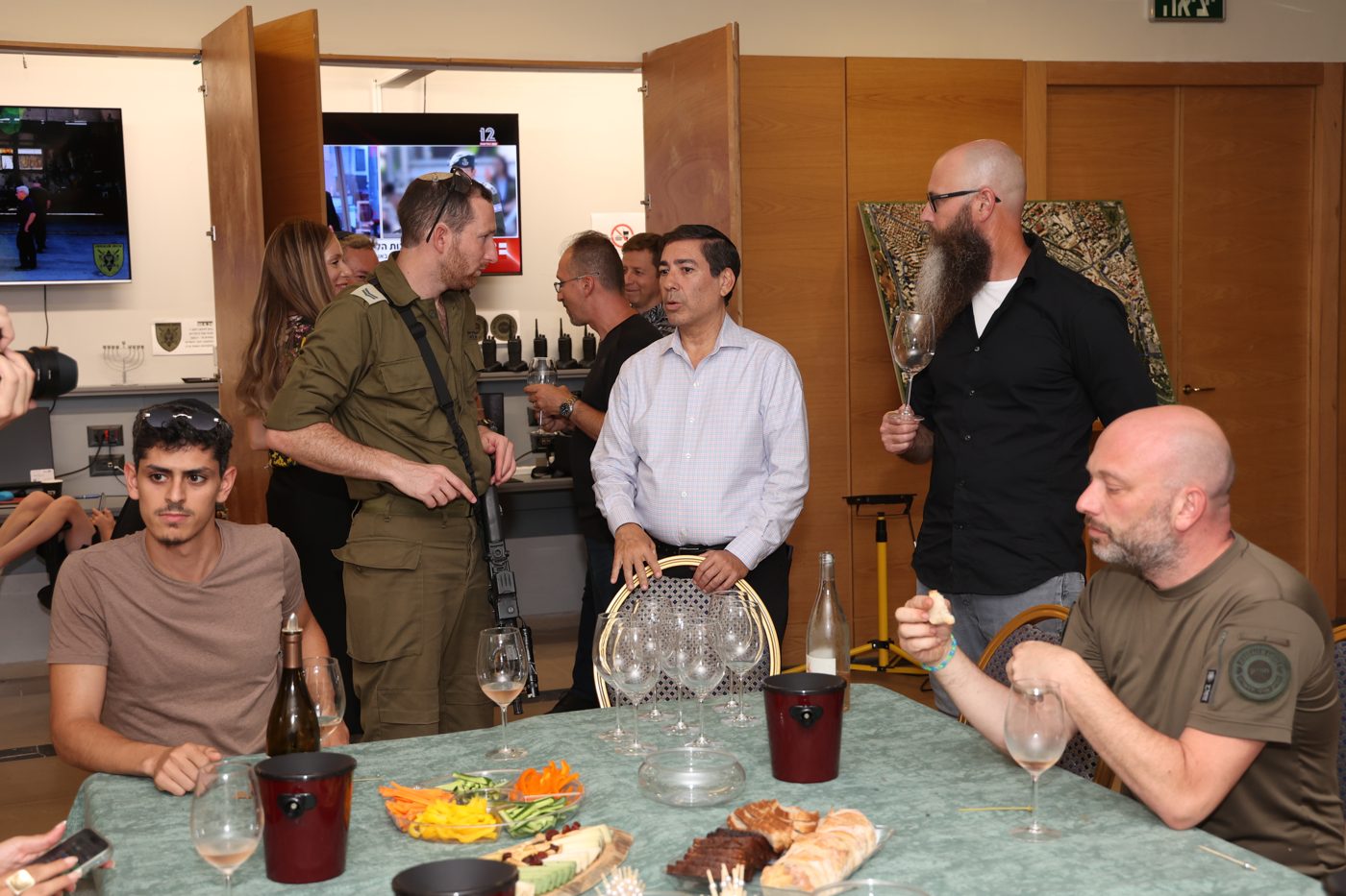 Itzik Stern leading a wine tasting in uniform